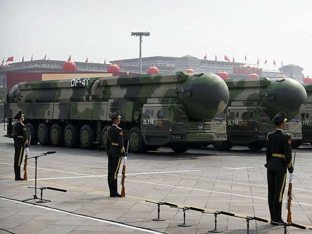 Chinese military vehicles carrying DF-41 ballistic missiles roll during a parade to commemorate the 70th anniversary of the founding of Communist China in Beijing, Tuesday, Oct. 1, 2019. Trucks carrying weapons including a nuclear-armed missile designed to evade U.S. defenses rumbled through Beijing as the Communist Party celebrated its 70th �K