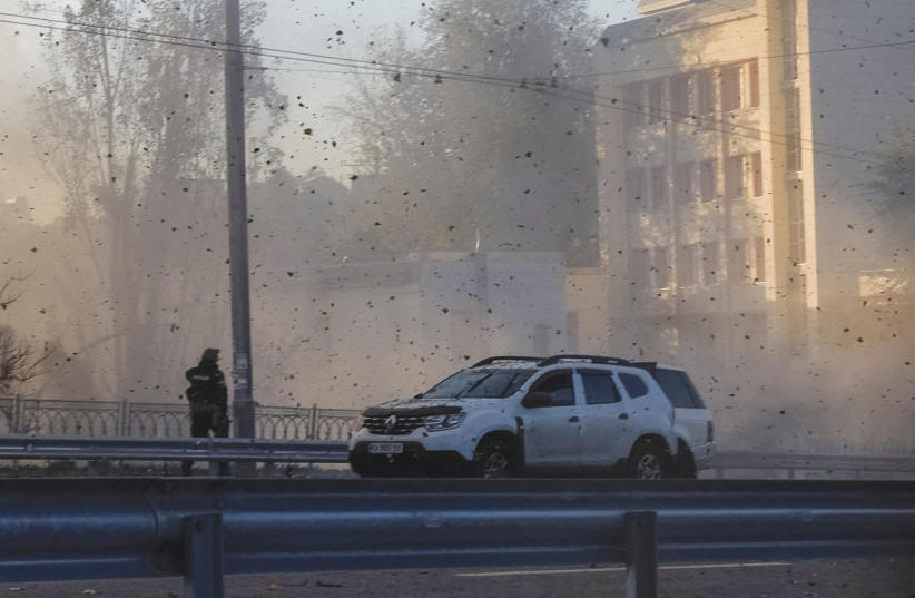  DEBRIS FLIES during a Russian drone strike, with what local authorities said was Iranian-made Shahed-136 UAVs, in Kyiv, Ukraine, Oct. 17.  (photo credit: Roman Petushkov/Reuters)