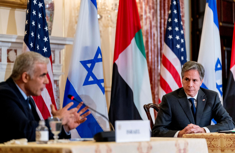 Israeli Foreign Minister Yair Lapid, accompanied by US Secretary of State Antony Blinken, speaks at a joint news conference at the State Department in Washington, US, October 13, 2021. (credit: ANDREW HARNIK/POOL VIA REUTERS)