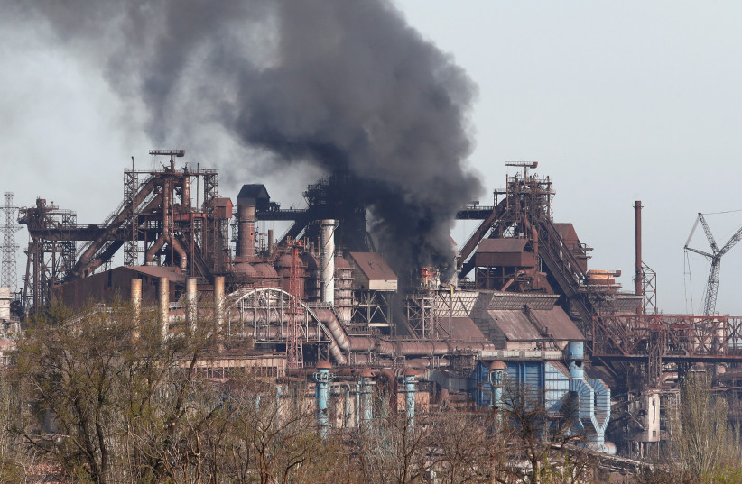 Smoke rises above a plant of Azovstal Iron and Steel Works during Ukraine-Russia conflict in the southern port city of Mariupol, Ukraine April 25, 2022. (credit: Alexander Ermochenko/Reuters)