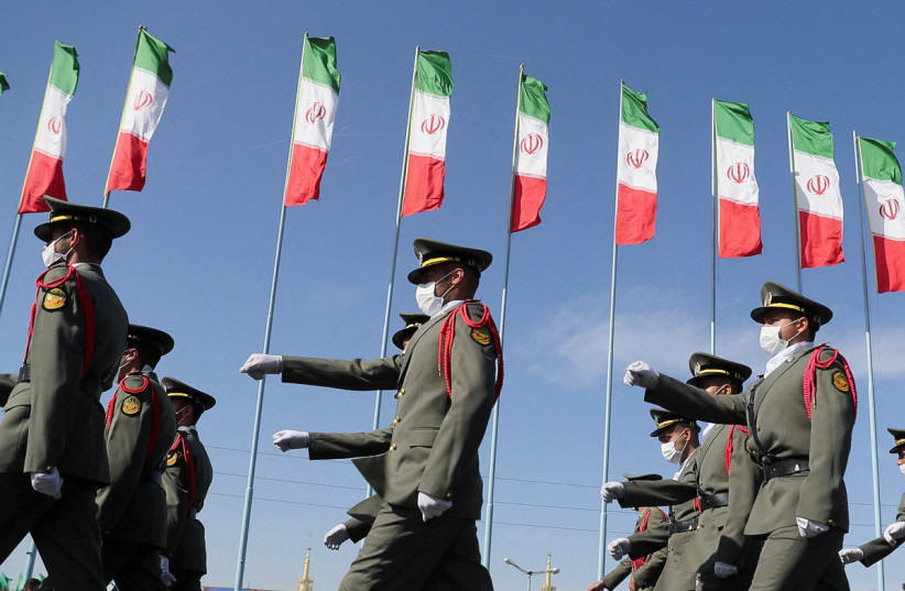 Iranian armed forces members march during a ceremony of the National Army Day parade in Tehran, Iran April 18, 2022 (photo credit: WANA NEWS AGENCY/REUTERS)
