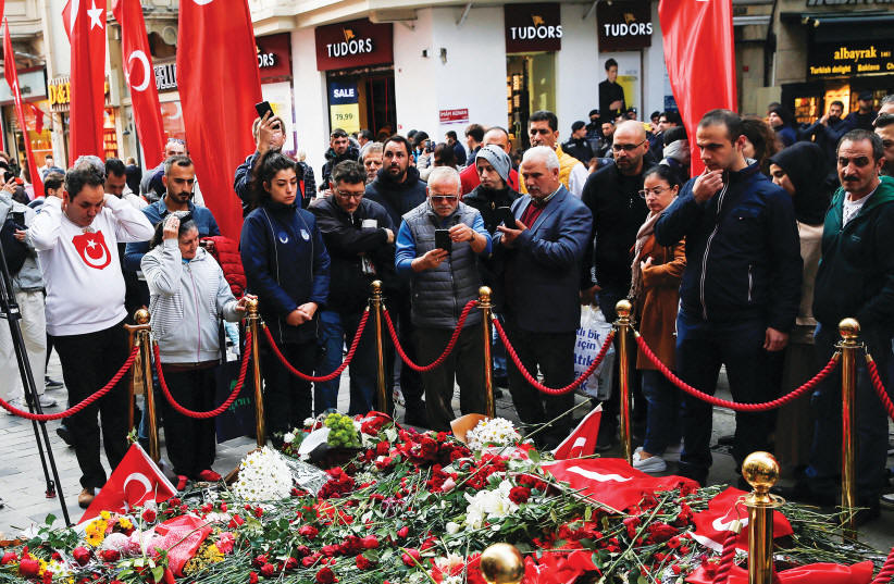  PEOPLE GATHER at a memorial in Istanbul to the victims of last month��s deadly blast at Gezi Park. (photo credit: DILARA SENKAYA/REUTERS)